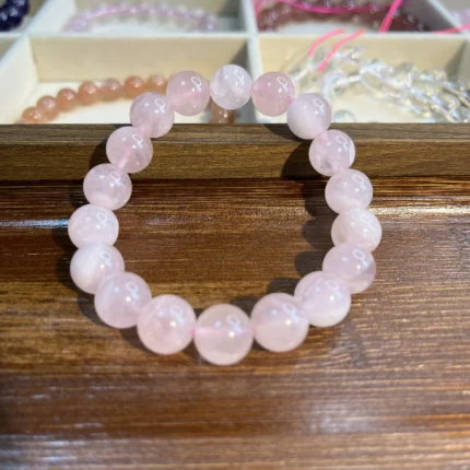 alt="light pink crystal bracelet rose quarts for memen depend on case"