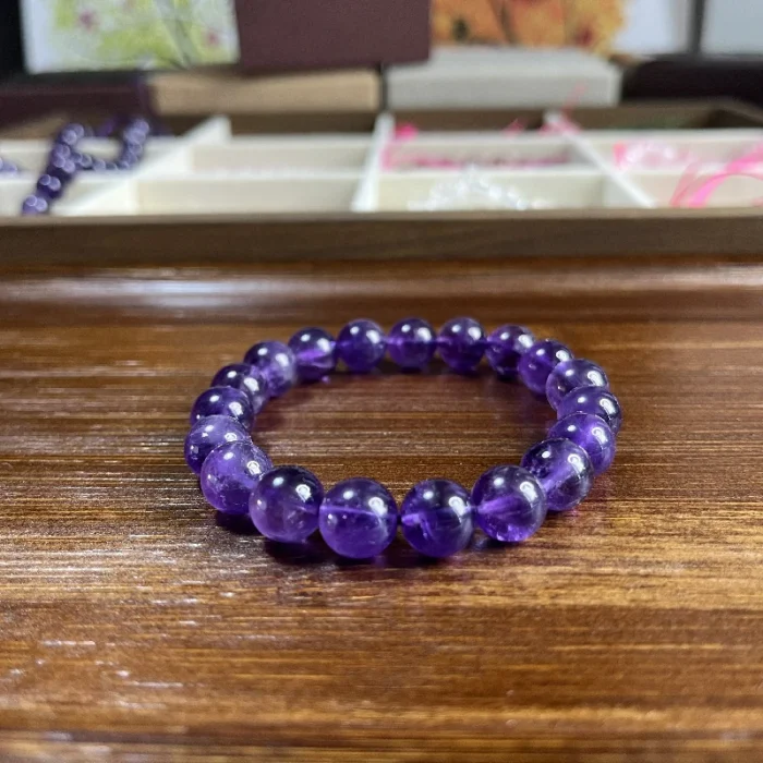 alt="purple crystal bracelet for women on desk"