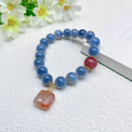 alt="blue carnelian bracelet on hand effect"