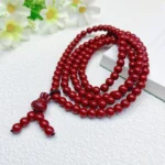 alt="cinnabar long bracelet 4 circles"