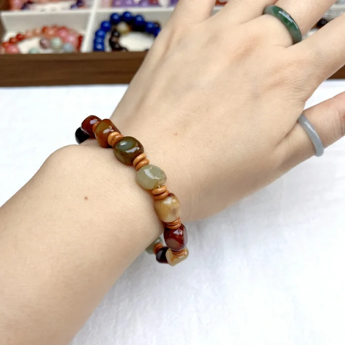 alt="cute colour jade bracelet on hand"