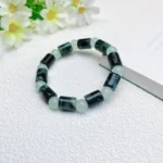 alt="cylinder shaped jade bracelet wear"