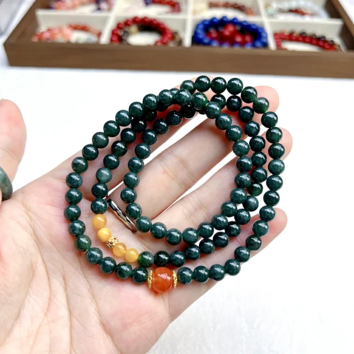 alt="deep green multi loop jade bracelet effect"