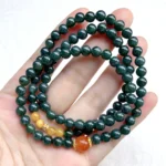 alt="deep green multi loop jade bracelet effect front"