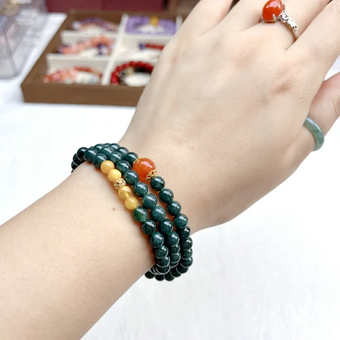 alt="deep green multi loop jade bracelet photo"