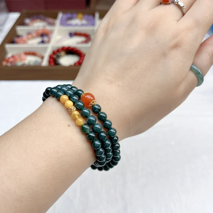 alt="deep green multi loop jade bracelet picture"