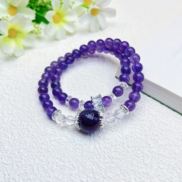alt="double circle amethyst crystal bracelet on hand photo"