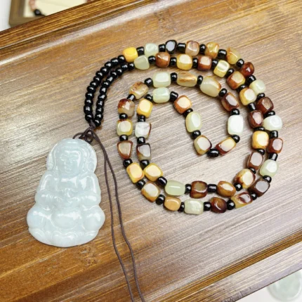 alt="gemstone buddha jade pendant"