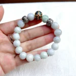 alt="jade bracelet in hand"