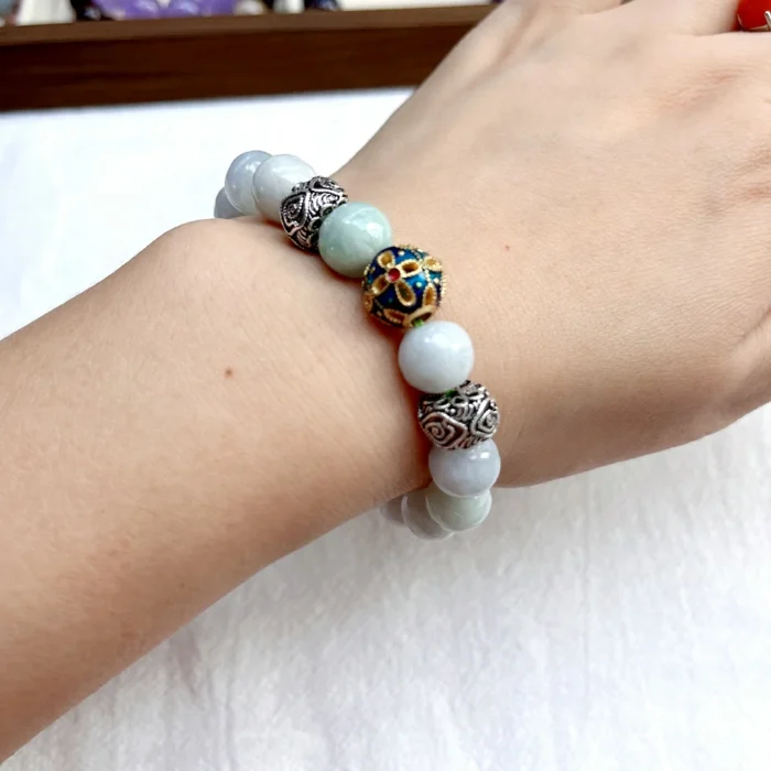 alt="jade bracelet on hand picture"