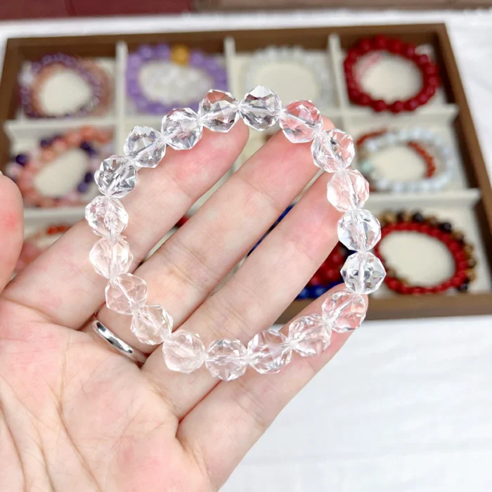 alt="multi faces cube crystal bracelet in hand"