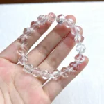 alt="multi faces cube crystal bracelet in hand"