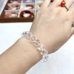 alt="multi faces cube crystal bracelet on hand"