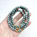 alt="multi loop deep green jade bracelet front"