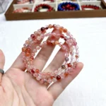 alt="orange multi loop crystal bracelet photo"