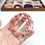 alt="orange multi loop crystal bracelet picture"