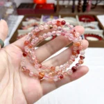 alt="orange multi loop crystal bracelet picture view"