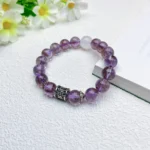 alt="pure purple crystal bracelet on plate"