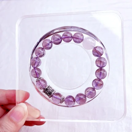 alt="pure purple crystal bracelet on plate"