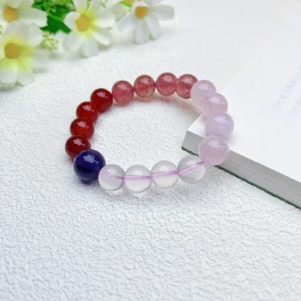 alt="red and purple carnelian crystal bracelet"