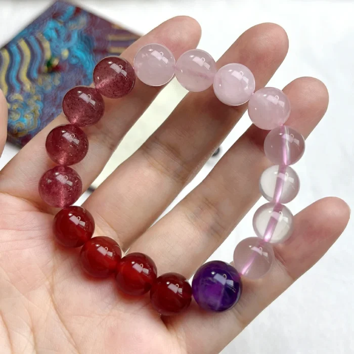 alt="red and purple carnelian crystal bracelet"