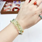 alt="soft green loop crystal bracelet photo"