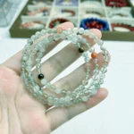 alt="soft green loop crystal bracelet picture"