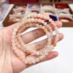 alt="soft orange multi loop crystal bracelet photo"