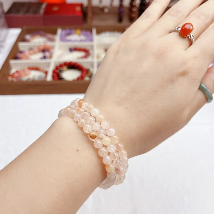 alt="soft orange multi loop crystal bracelet picture: