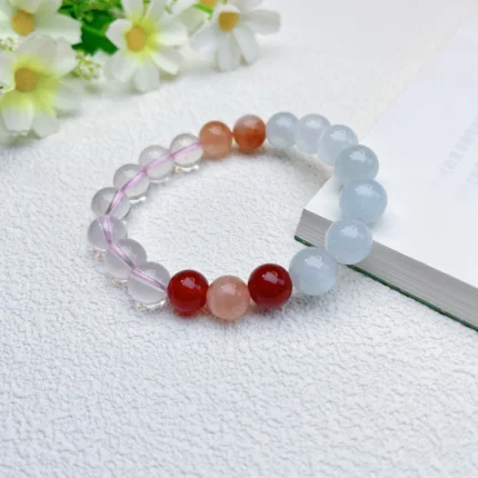 alt="white blue orange crystal bracelet"
