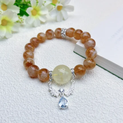 alt="yellow crystal bracelet on plate"