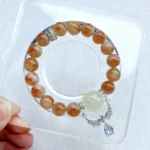 alt="yellow crystal bracelet on plate"