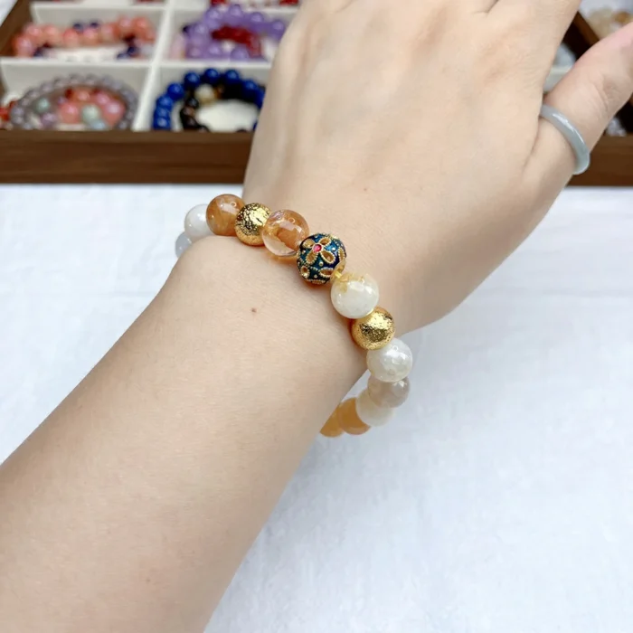 alt="yellow crystal bracelet on wear"