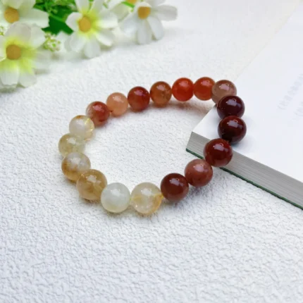 alt="yellow tower orange money crystal bracelet"