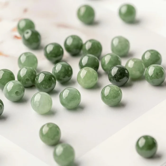 alt="nature deep green jateite gemstone beads"