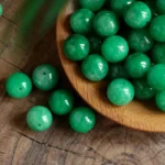 alt="nature light green jateite beads"