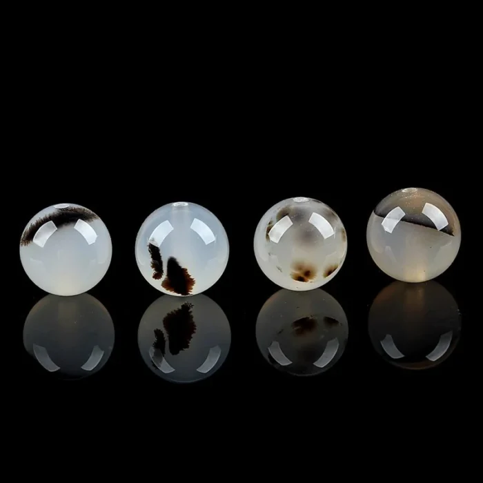 alt="nature black white carnelian beads"